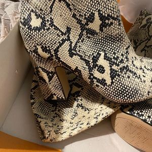 Brand new Animal print boots. Never been worn.